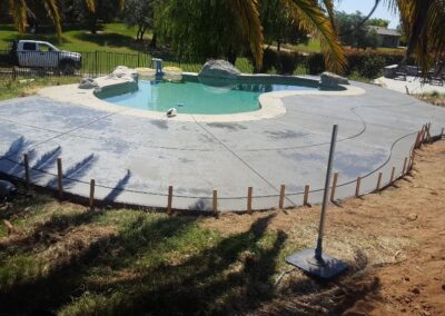 Stamped concrete around pool new deck